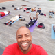 Changa Bell (front), founder of the Black Male Yoga Initiative, with students
Courtesy of Changa Bell